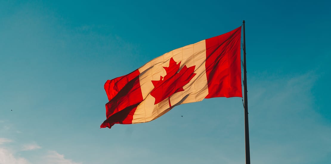 Scenic view of Canada with mountains and river – Explore immigration opportunities with Assist Immigration.